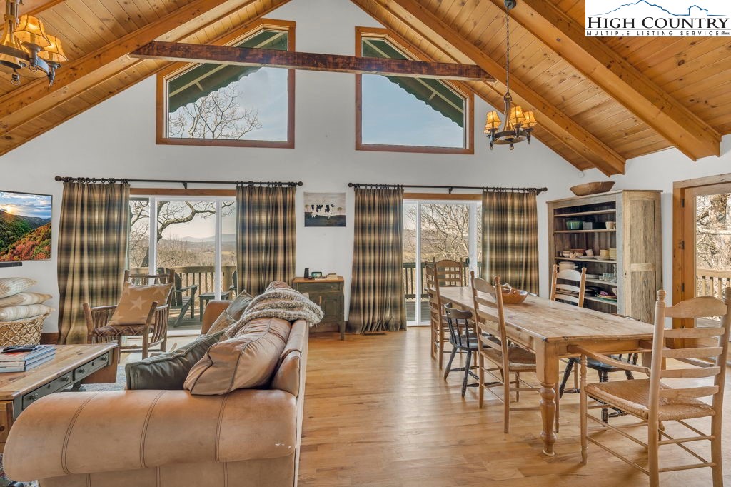 198 Laurel Hill Lane Boone, NC 28607 - Photo 21 of 50 a living room with furniture and a large window