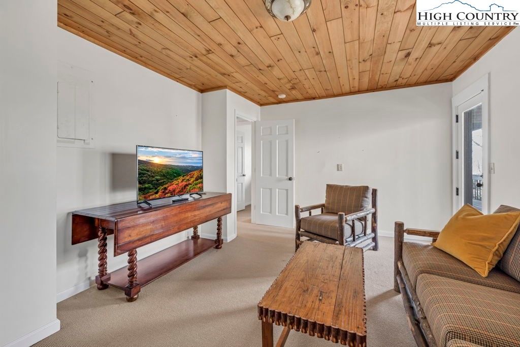 198 Laurel Hill Lane Boone, NC 28607 - Photo 40 of 50 a living room with furniture and a flat screen tv