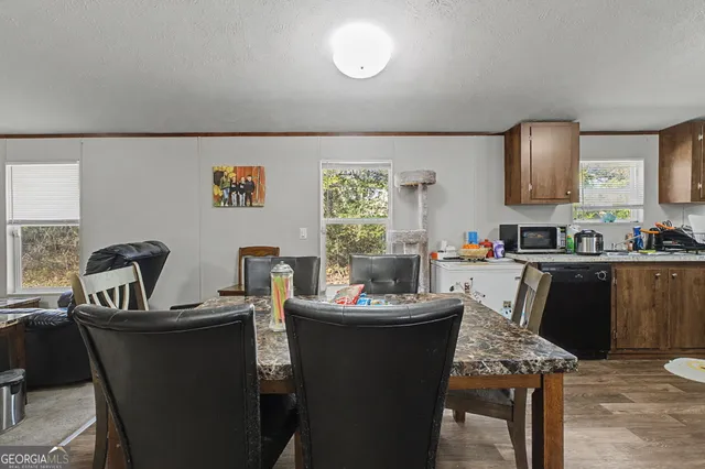 a dining room with furniture and window