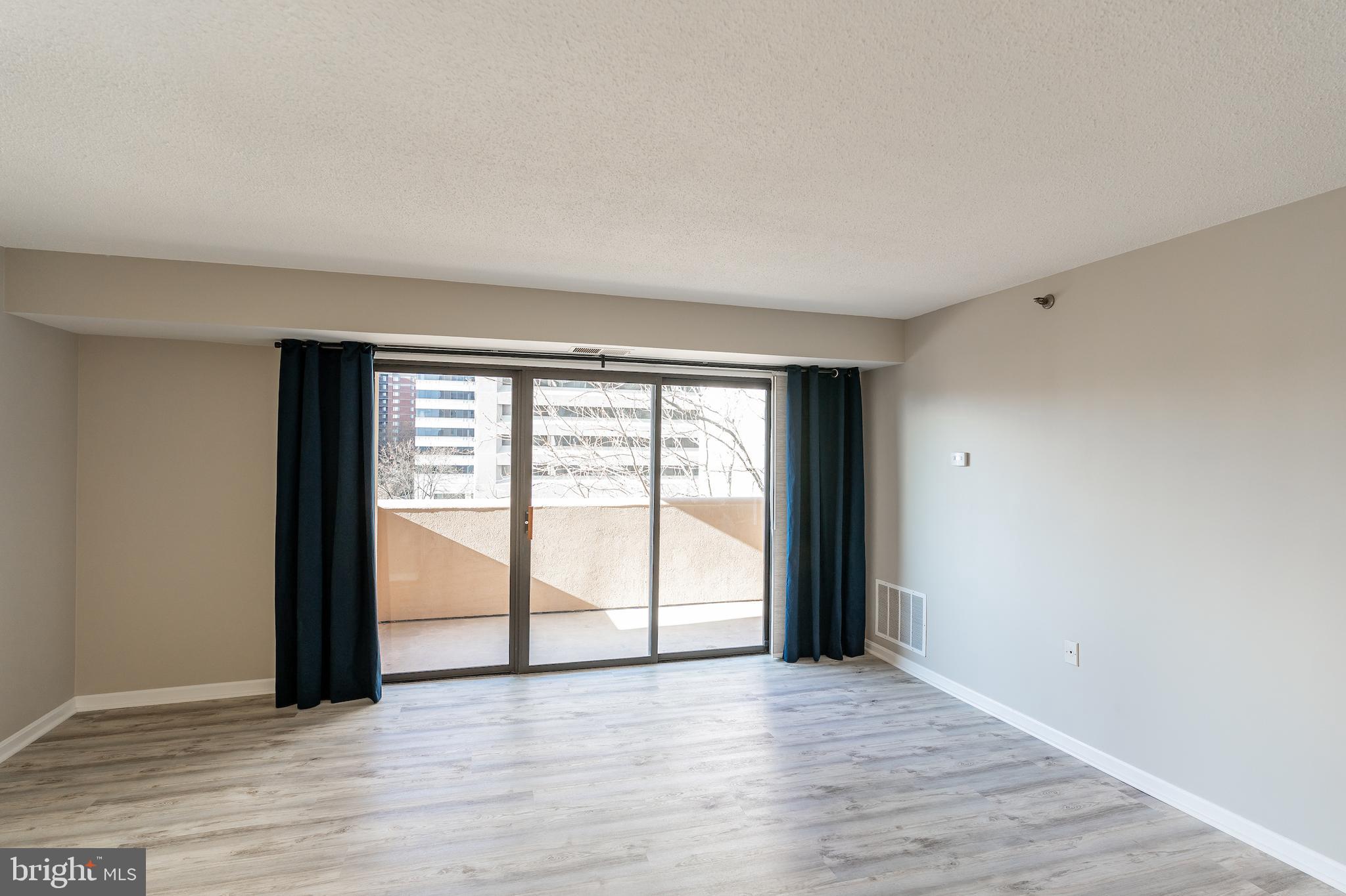 1301 North Courthouse Road, Unit 701 Arlington, VA 22201 - Photo 4 of 22 Large sliders to let in natural light