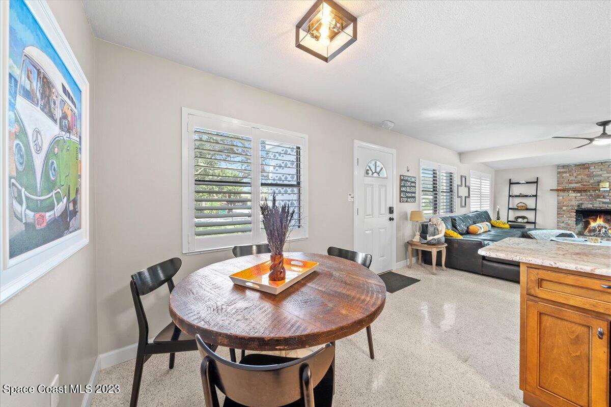 550 Capri Road Cocoa Beach, FL 32931 - Photo 14 of 36 a view of a dining room with furniture window and wooden floor