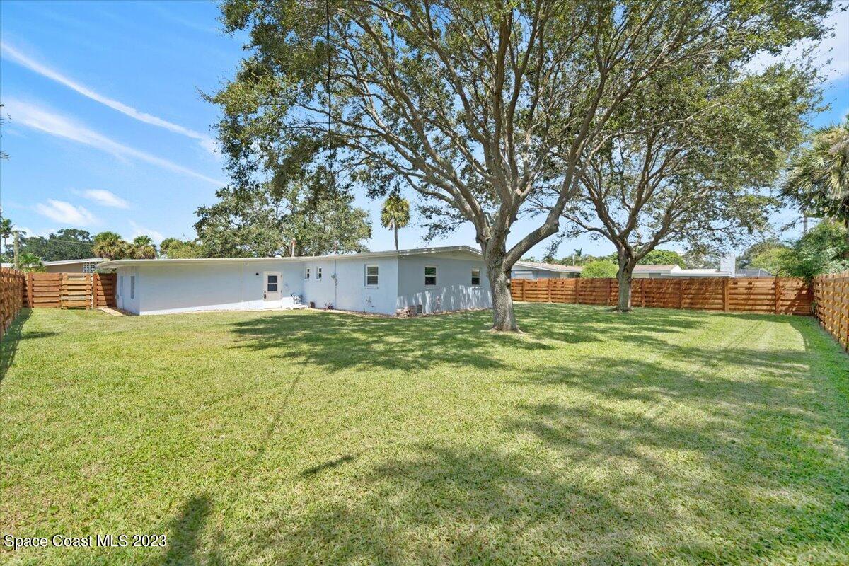550 Capri Road Cocoa Beach, FL 32931 - Photo 24 of 36 a view of a house with a yard