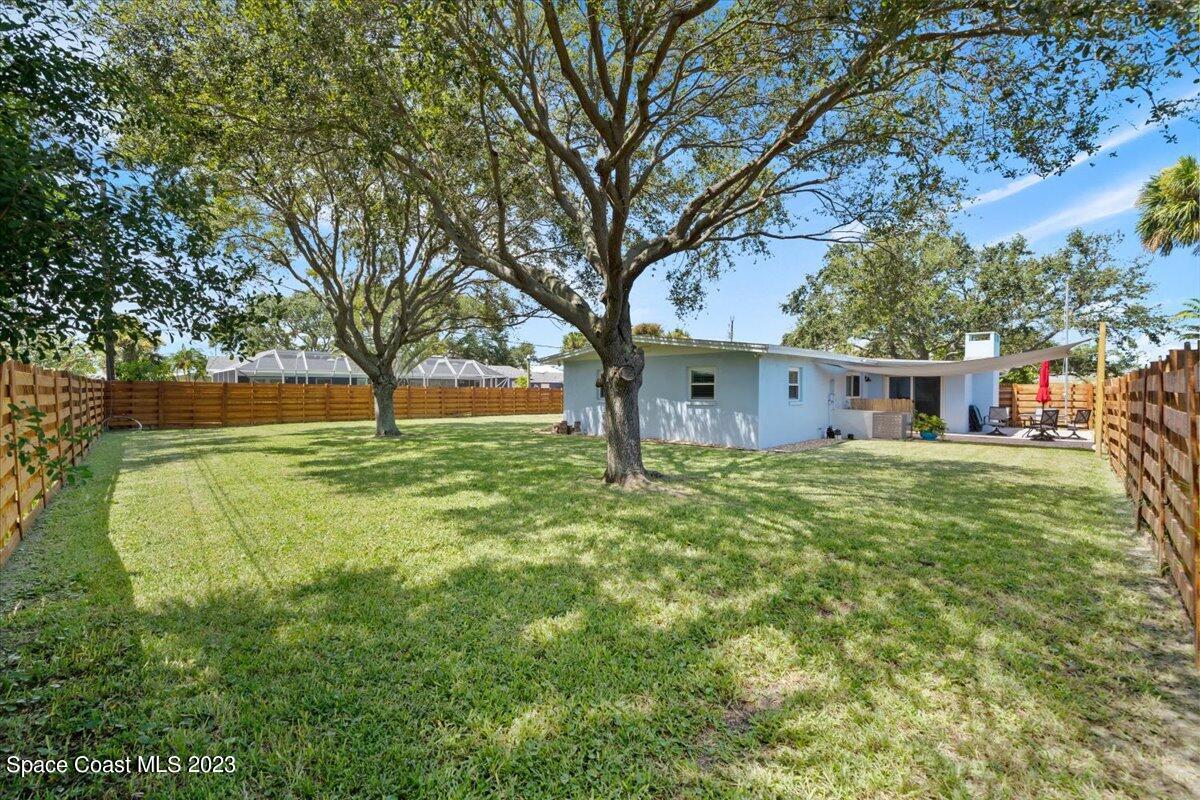 550 Capri Road Cocoa Beach, FL 32931 - Photo 25 of 36 a view of a house with a back yard
