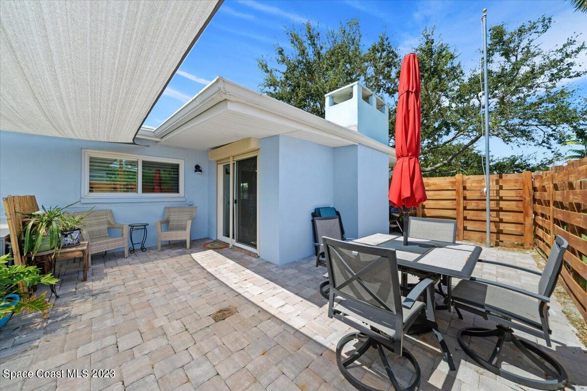 550 Capri Road Cocoa Beach, FL 32931 - Photo 26 of 36 a view of a patio with table and chairs and potted plants