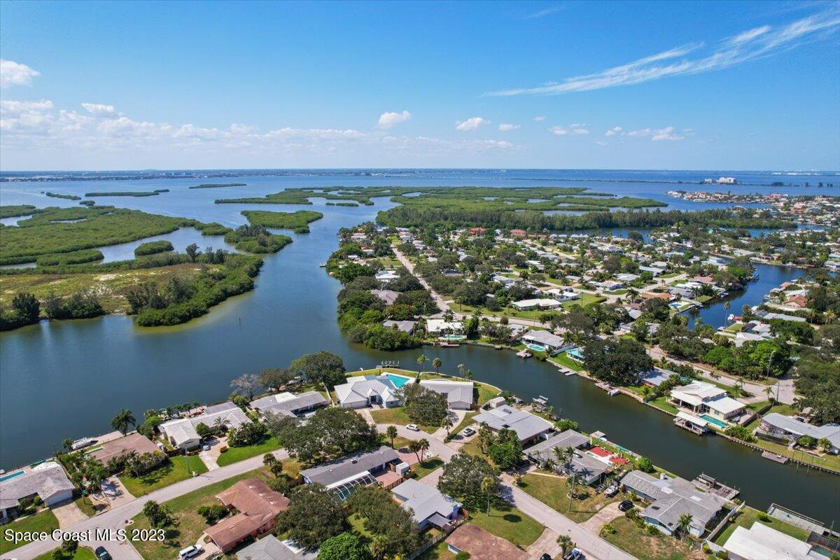 550 Capri Road Cocoa Beach, FL 32931 - Photo 31 of 36 an aerial view of lake residential house with outdoor space