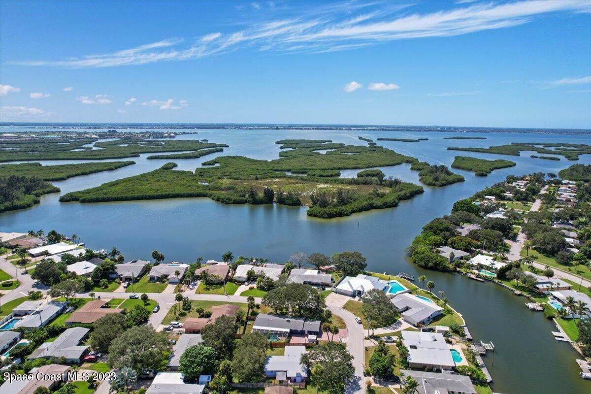 550 Capri Road Cocoa Beach, FL 32931 - Photo 32 of 36 an aerial view of a house with a lake view