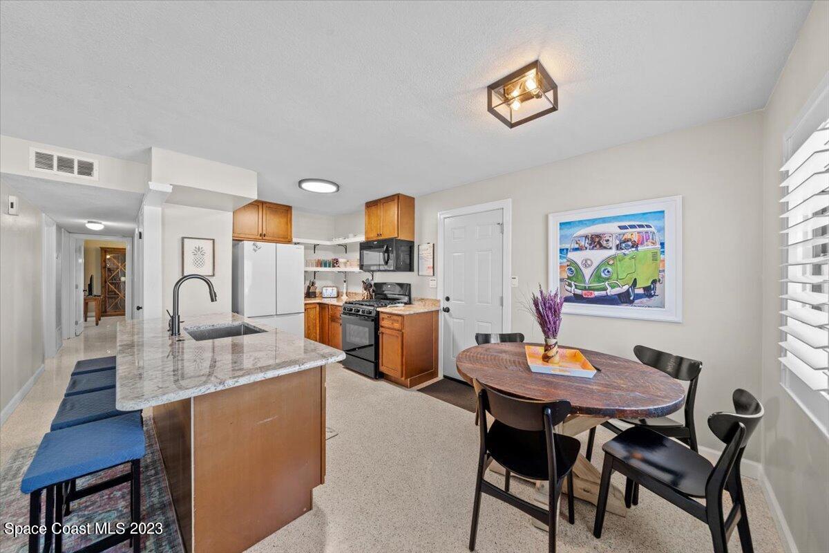 550 Capri Road Cocoa Beach, FL 32931 - Photo 10 of 36 a view of a dining room with furniture