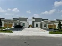 a front view of house with yard and car parked