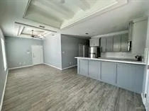 a view of a kitchen with a sink and cabinets