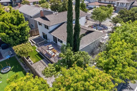 an aerial view of a house with a garden