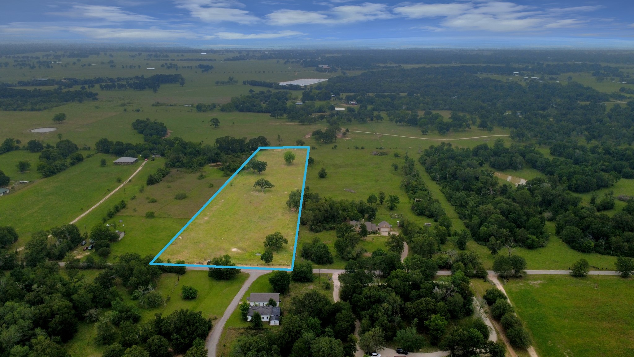 47130 Qualls Road Hempstead, TX 77445 - Photo 8 of 10 an aerial view of residential houses with outdoor space and river