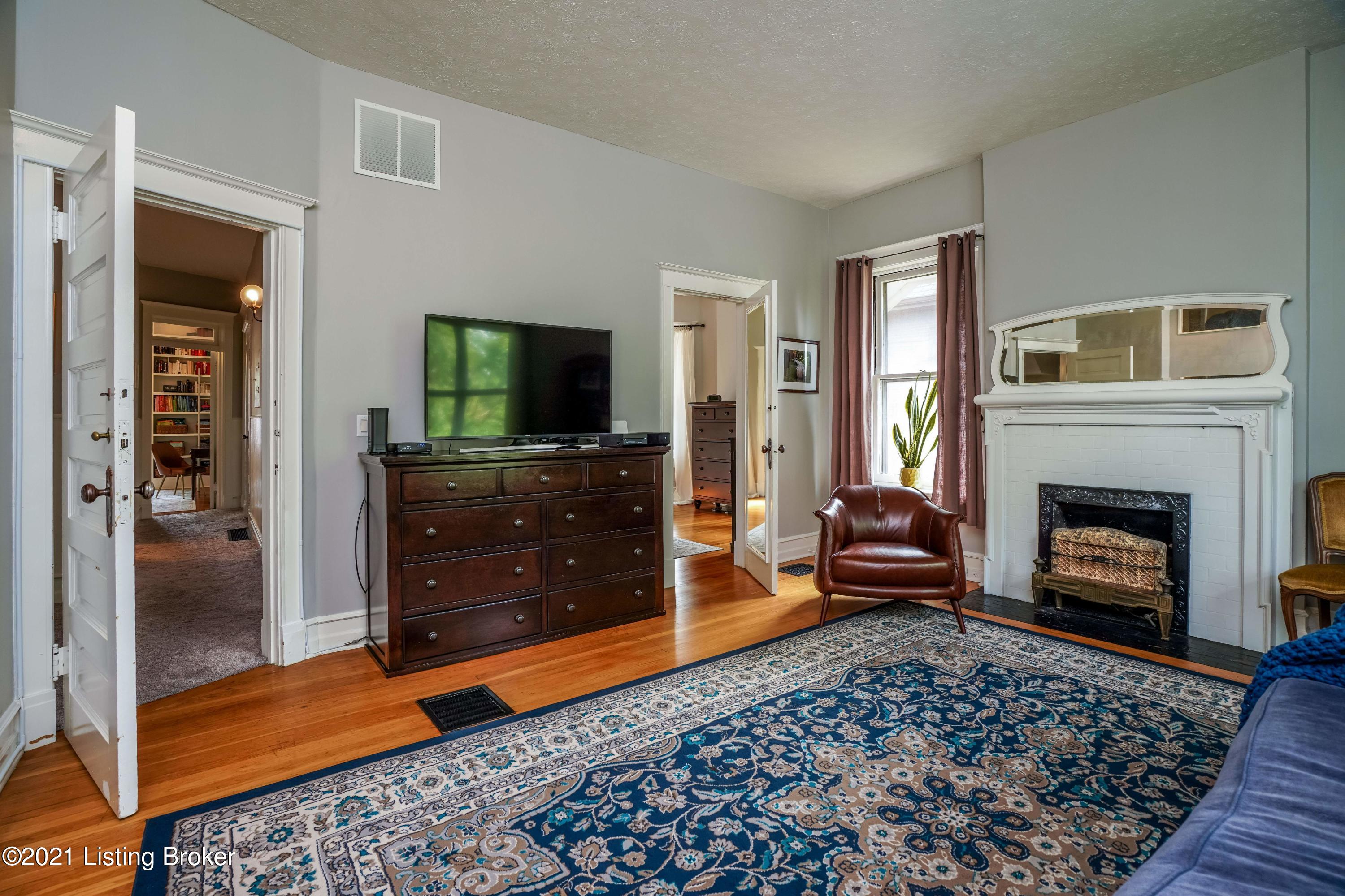 1279 Cherokee Road Louisville, KY 40204 - Photo 23 of 52 Primary bedroom with fireplace and walk-in closet.