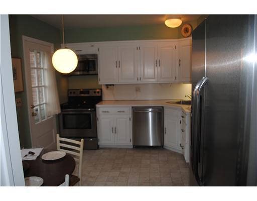 155 Field Point Road, Unit 1N Greenwich, CT 06830 - Photo 2 of 7 a kitchen with a refrigerator and a sink