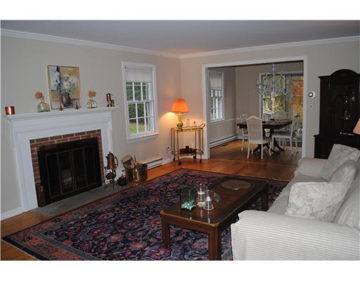 155 Field Point Road, Unit 1N Greenwich, CT 06830 - Photo 3 of 7 a living room with furniture and a fireplace
