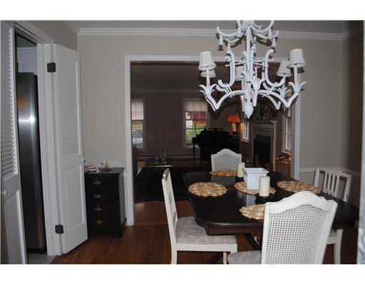 155 Field Point Road, Unit 1N Greenwich, CT 06830 - Photo 5 of 7 a view of a dining room with furniture and chandelier