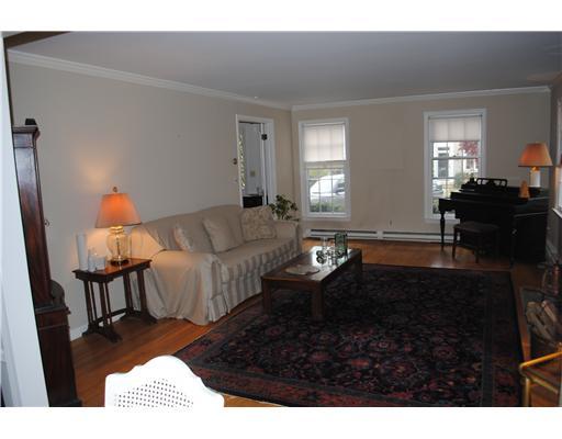 155 Field Point Road, Unit 1N Greenwich, CT 06830 - Photo 6 of 7 a living room with furniture and a rug