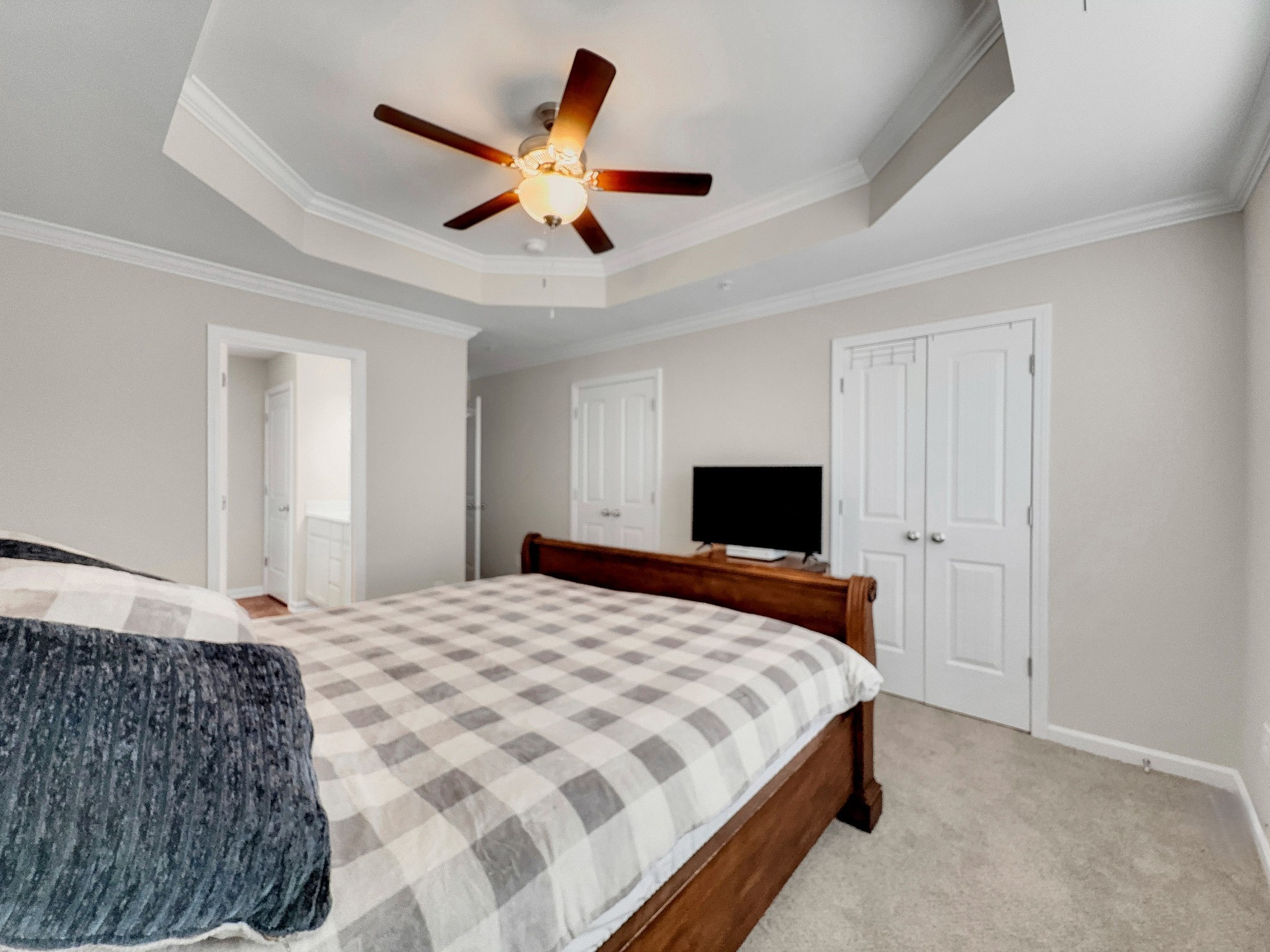 147 Addi Street Pleasant View, TN 37146 - Photo 14 of 26 a bedroom with a large bed and a flat screen tv