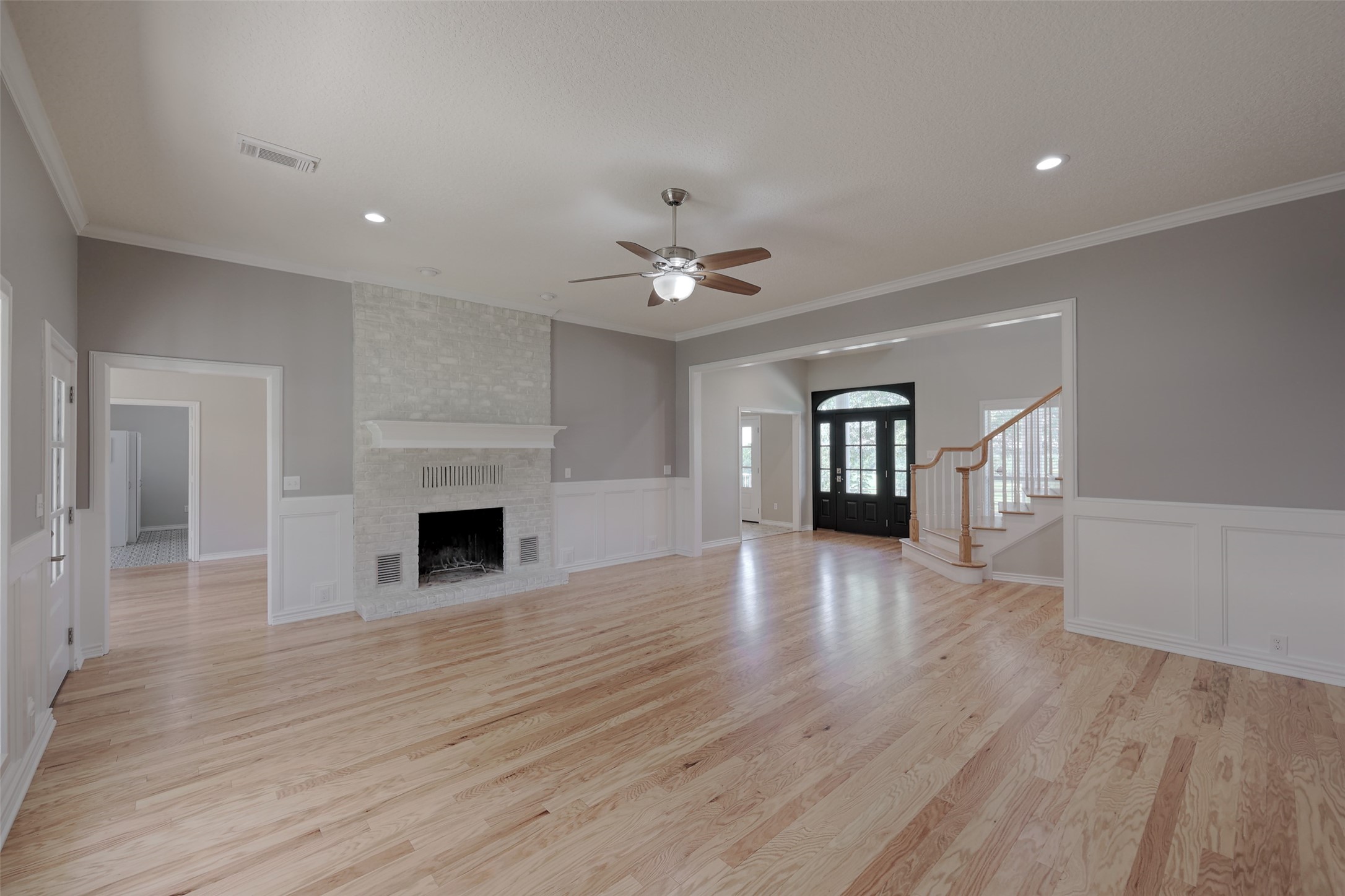 2 Highland Drive Huntsville, TX 77320 - Photo 14 of 50 a view of an empty room with window and wooden floor