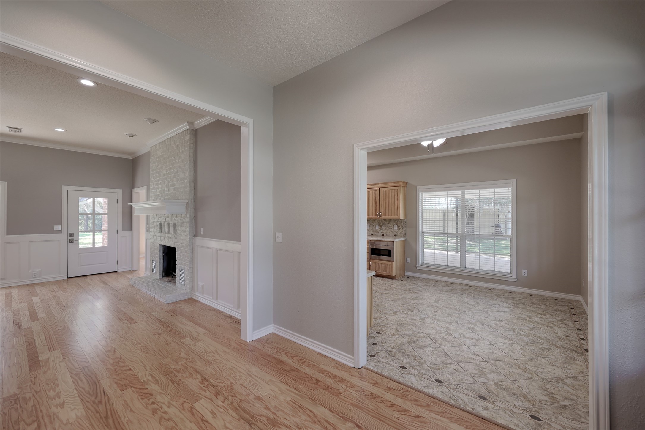2 Highland Drive Huntsville, TX 77320 - Photo 15 of 50 an empty room with wooden floor and windows