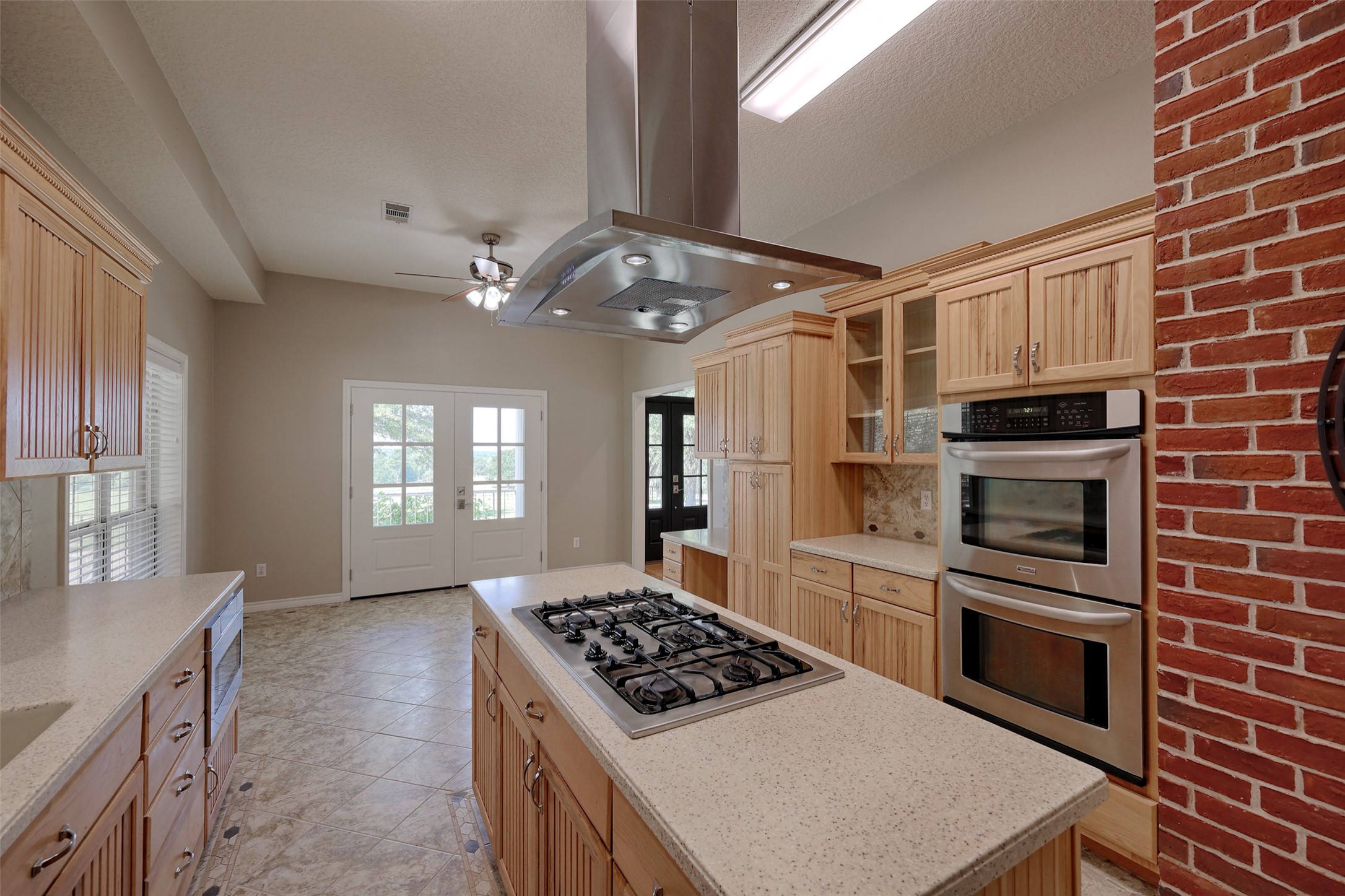 2 Highland Drive Huntsville, TX 77320 - Photo 19 of 50 a kitchen with a stove a sink and a refrigerator
