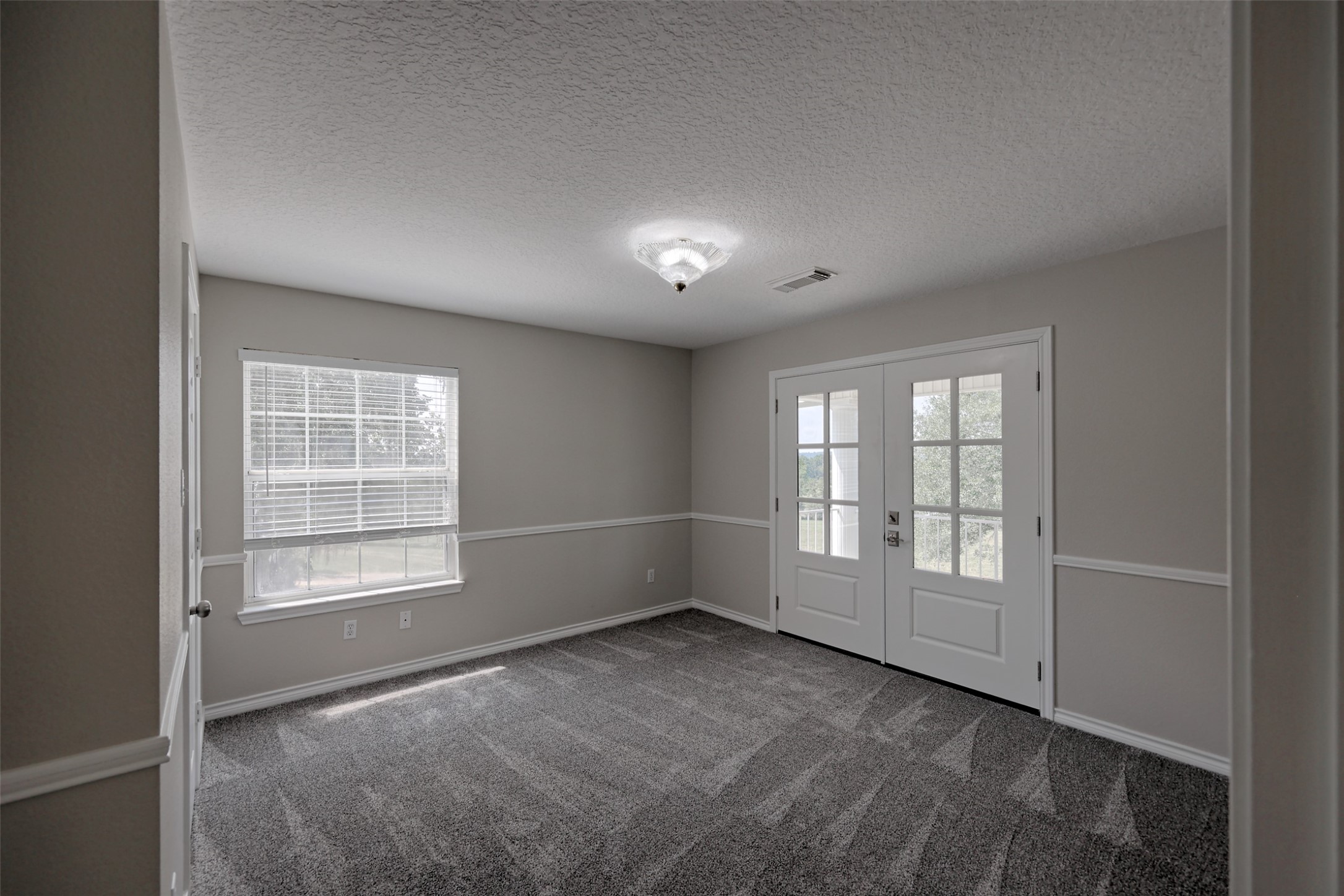 2 Highland Drive Huntsville, TX 77320 - Photo 31 of 50 an empty room with windows