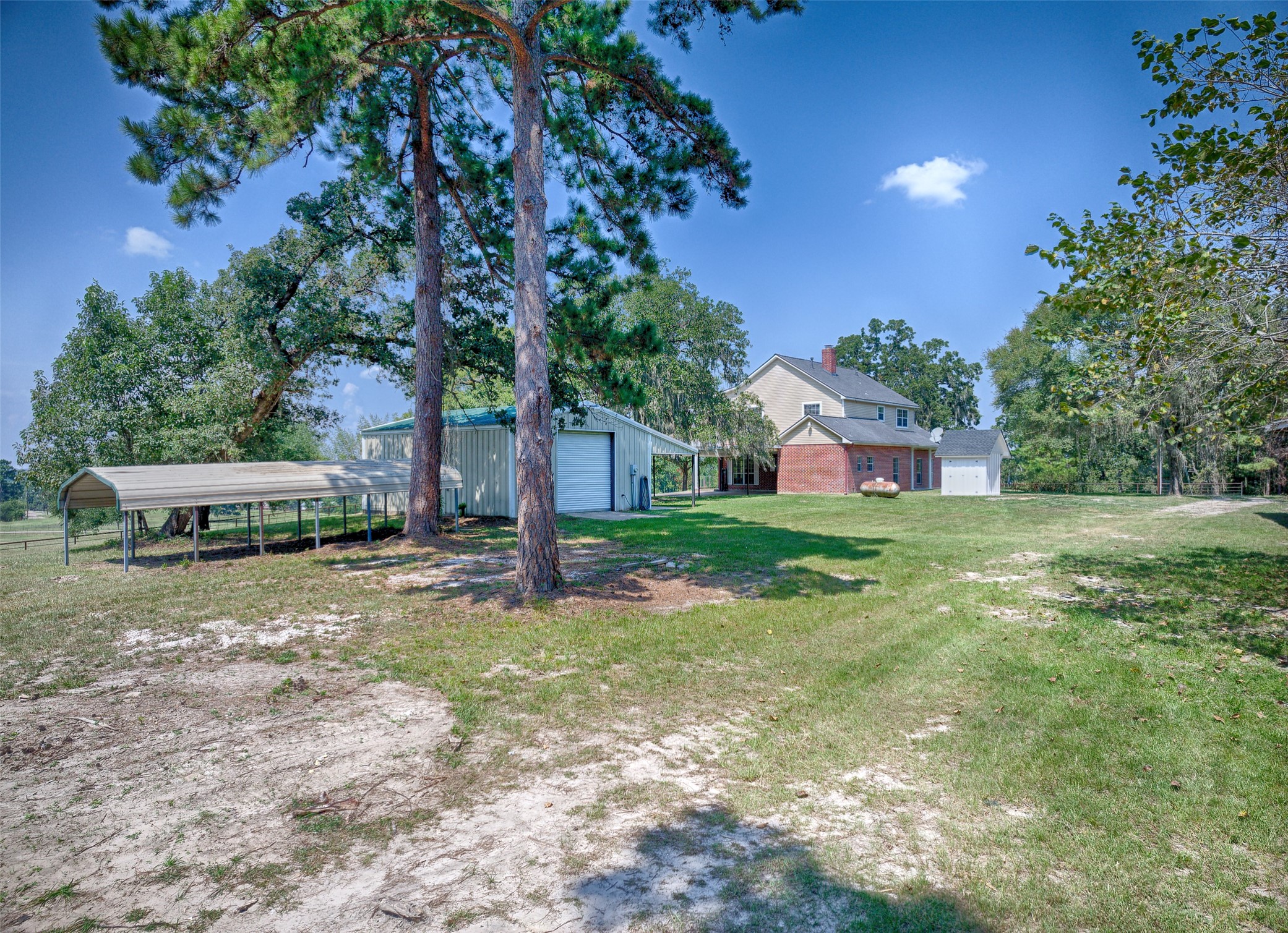 2 Highland Drive Huntsville, TX 77320 - Photo 41 of 50 a view of a house with yard and sitting area