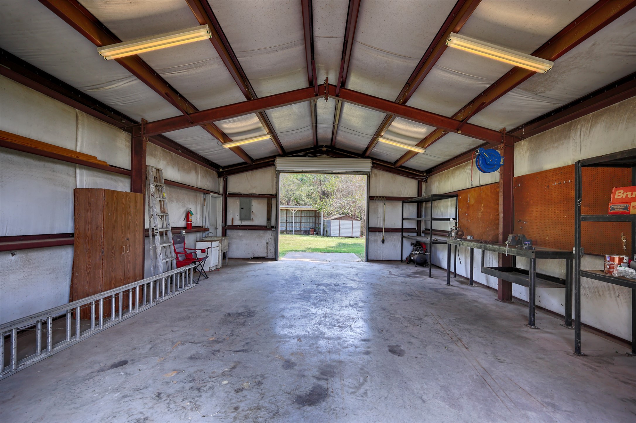 2 Highland Drive Huntsville, TX 77320 - Photo 43 of 50 a view of a room with wooden ceiling