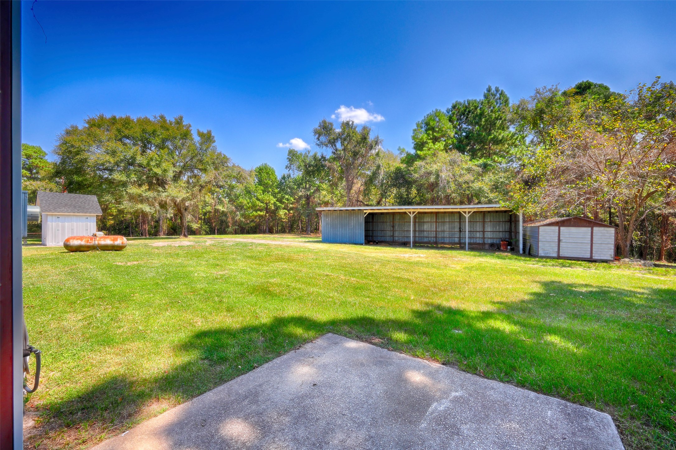 2 Highland Drive Huntsville, TX 77320 - Photo 44 of 50 a front view of a house with a yard