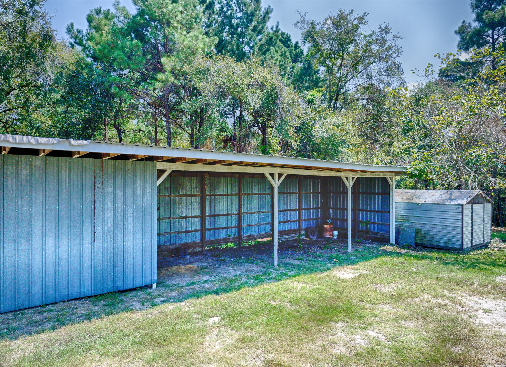 2 Highland Drive Huntsville, TX 77320 - Photo 45 of 50 front view of a house with a yard and wooden fence