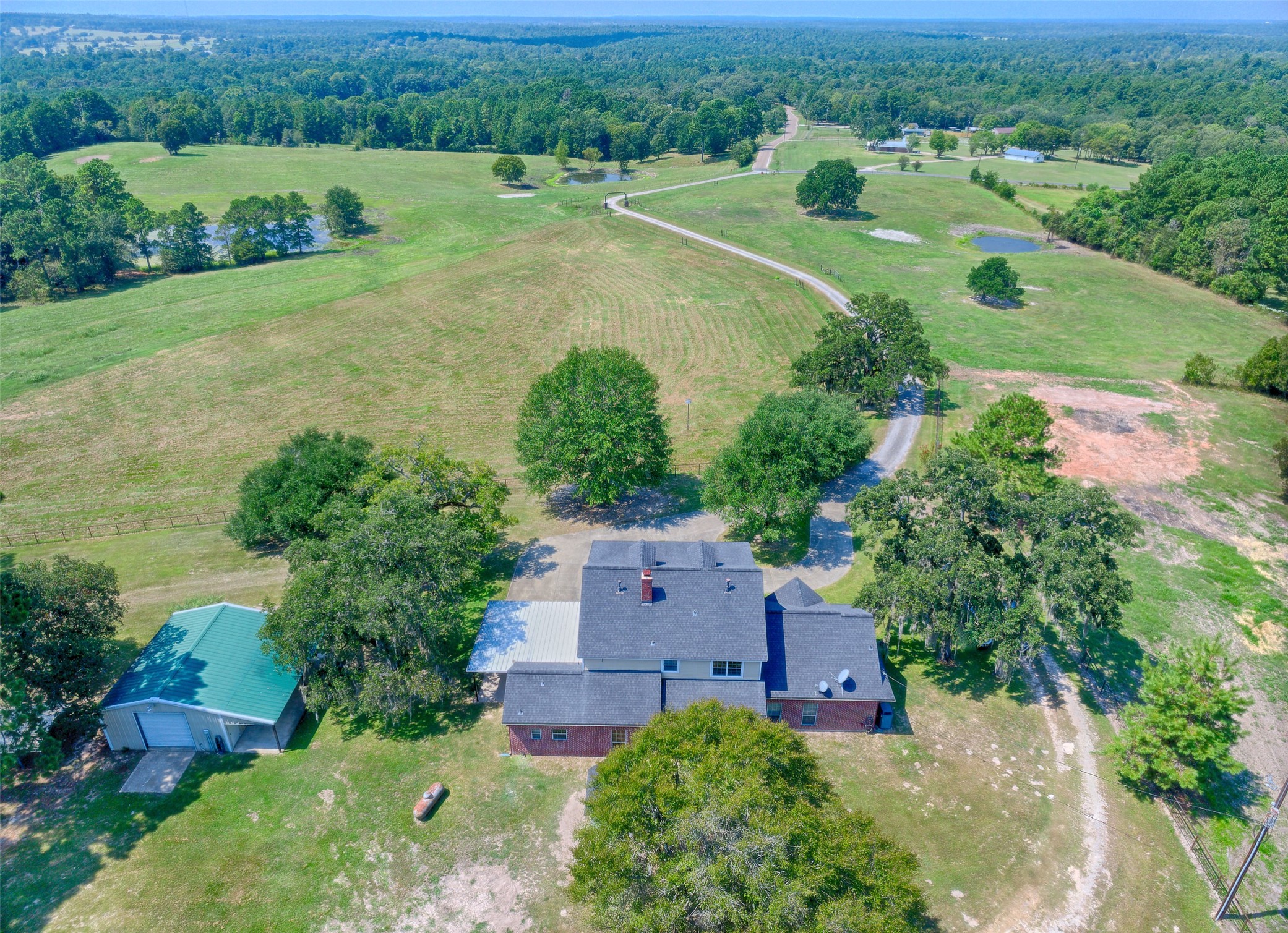 2 Highland Drive Huntsville, TX 77320 - Photo 6 of 50 an aerial view of a house with a garden