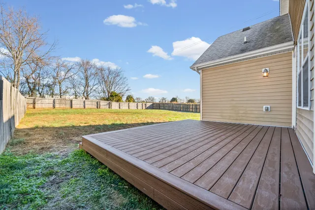 a view of a yard with wooden floor