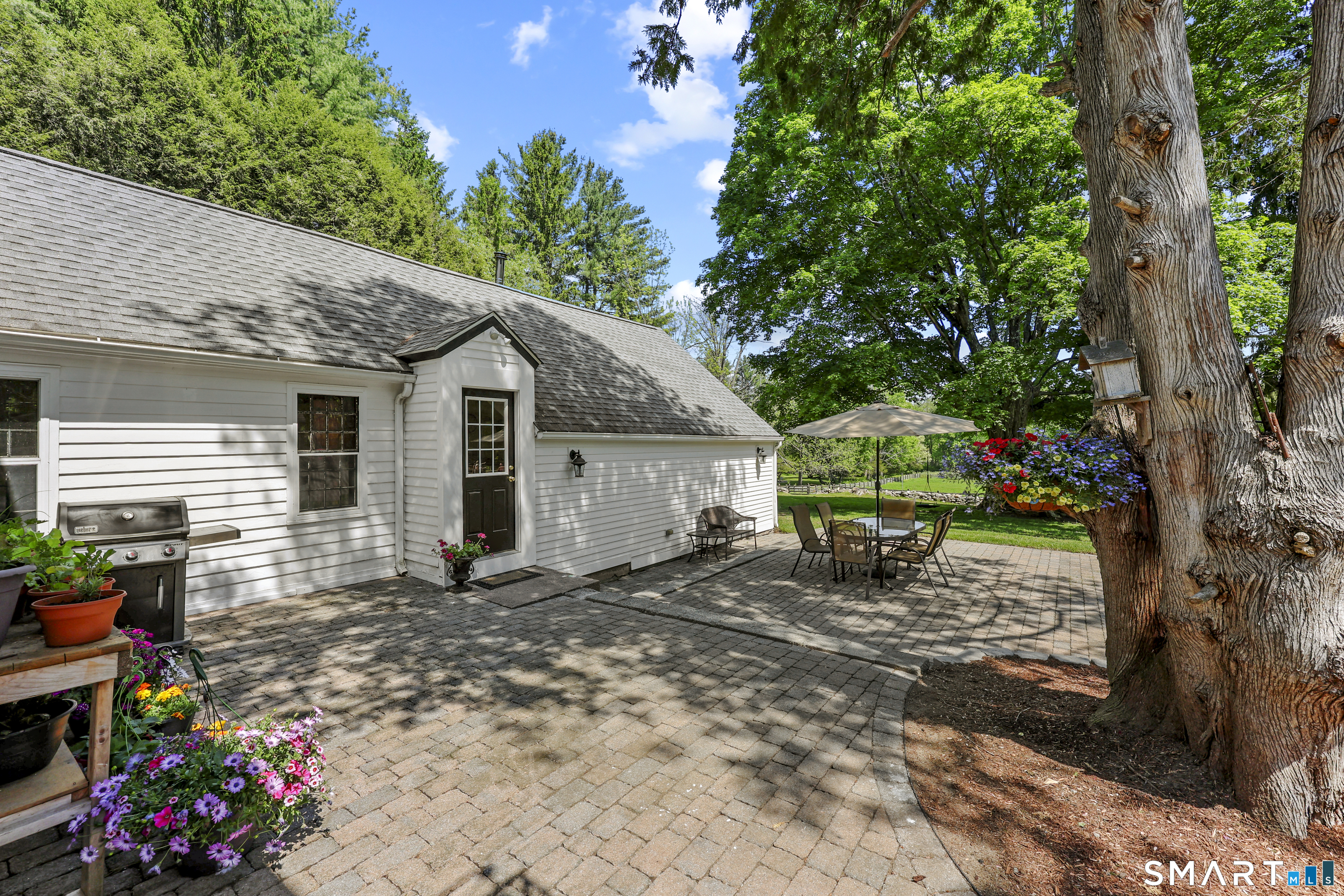 2880 Main Street Coventry, CT 06238 - Photo 6 of 40 Enjoy dewy morning pasture views and firefly flickering evenings on the patio.