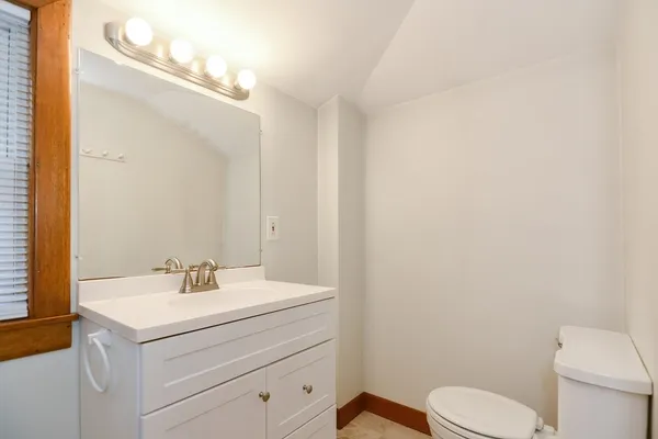 a bathroom with a sink a mirror and a shower