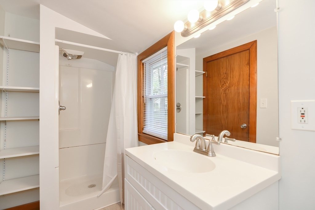 30 Sunset Lane Lunenburg, MA 01462 - Photo 12 of 29 a bathroom with a sink a mirror and a shower
