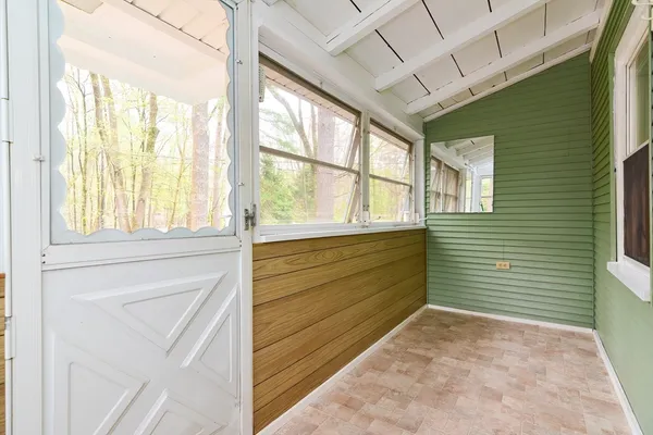 a view of a room with wooden walls