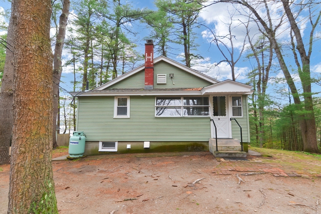 30 Sunset Lane Lunenburg, MA 01462 - Photo 20 of 29 a front view of a house with a yard and garage