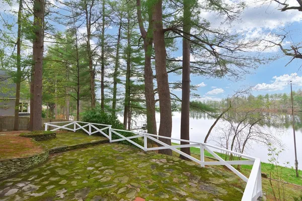 a view of swimming pool with chairs