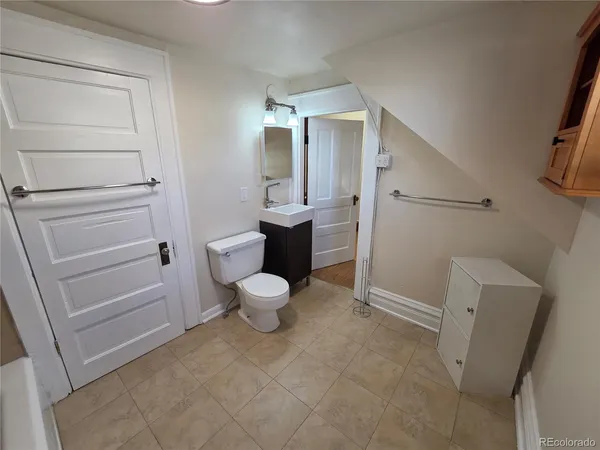 a bathroom with a sink and mirror