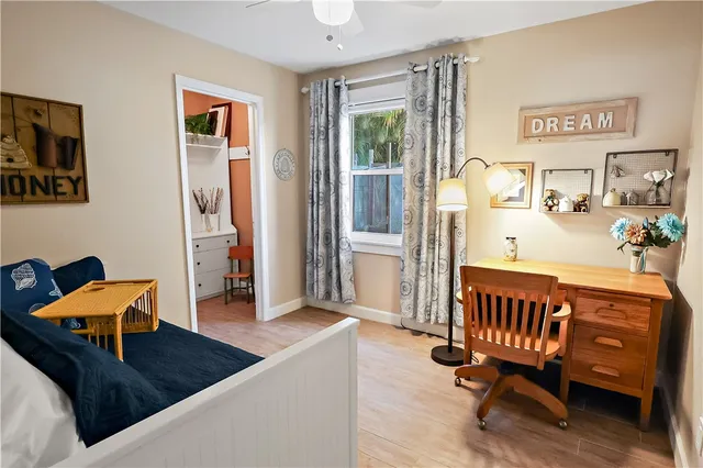 a bedroom with furniture and a window