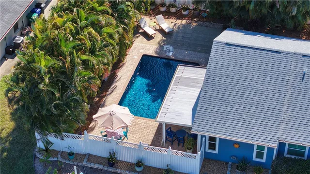a balcony with furniture and wooden floor