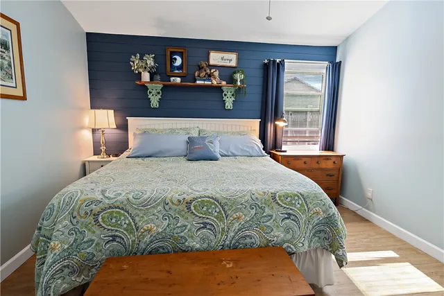 a bedroom with a bed and window