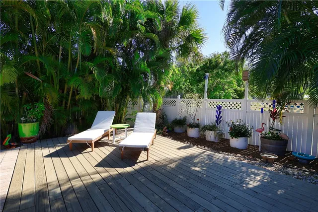 a view of a house with swimming pool and sitting area