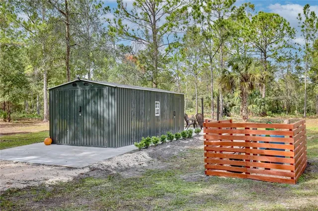 a backyard of a house with wooden fence