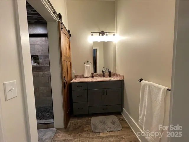 a living room with furniture and a lamp