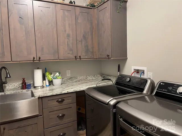 a living room with patio furniture and a floor to ceiling window