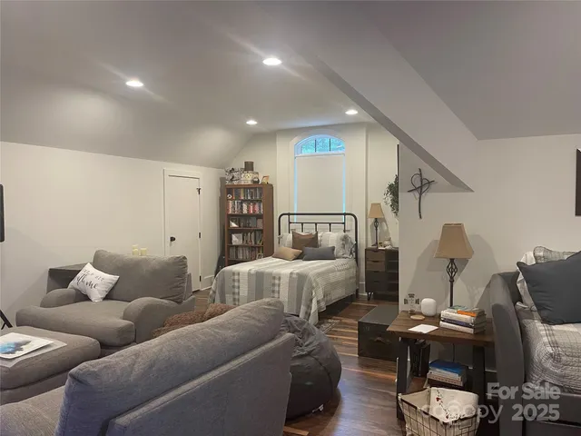 a view of a hallway with wooden floor and entryway
