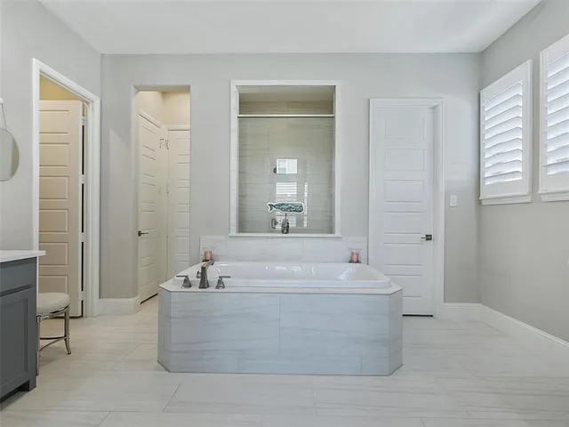 a view of a bath tub sitting in a bathroom