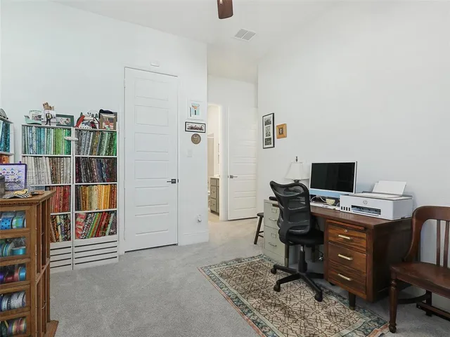 a view of a workspace with furniture