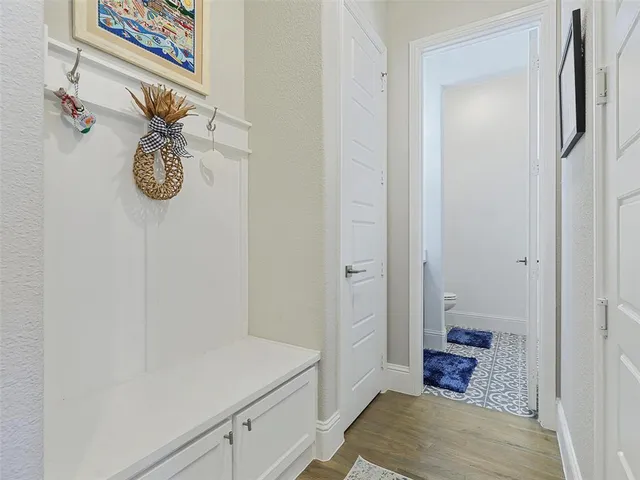 a bathroom with a shower and mirror