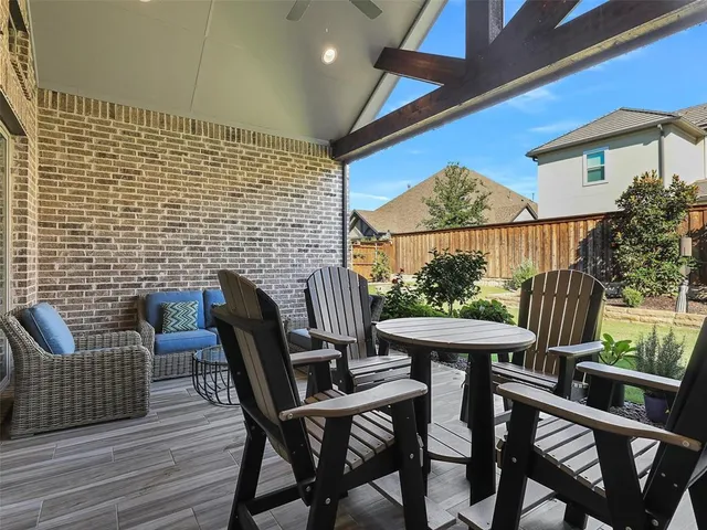 a view of a chairs and table in the patio